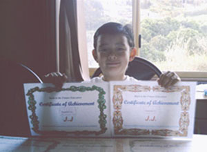 JJ with his MathsPower Certificates.